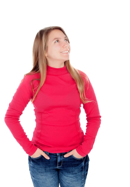 Teenager blonde girl in red looking up