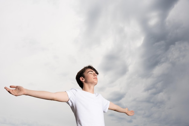 Teenager boy breathing in nature