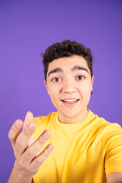 Teenager boy talking to camera