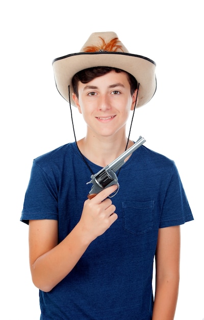 Teenager boy with a cowboy hat and a gun 