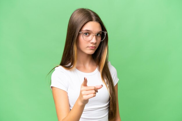 Teenager caucasian girl over isolated background frustrated and pointing to the front