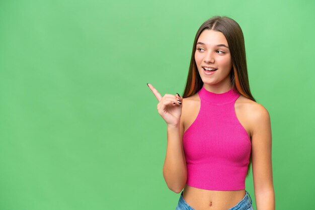 Teenager caucasian girl over isolated background intending to realizes the solution while lifting a finger up