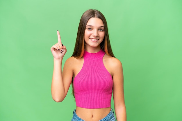 Teenager caucasian girl over isolated background pointing up a great idea