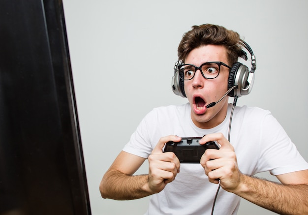 Teenager caucasian man playing computer games