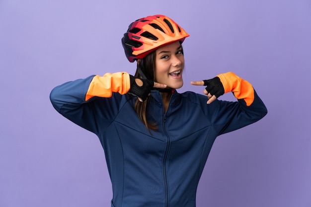 Teenager cyclist girl giving a thumbs up gesture