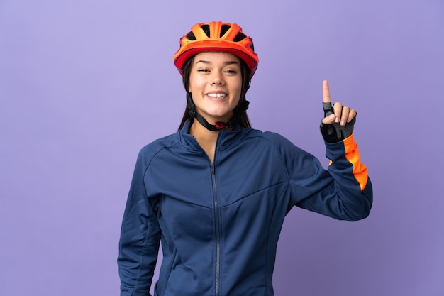 Ragazza del ciclista dell'adolescente che indica una grande idea