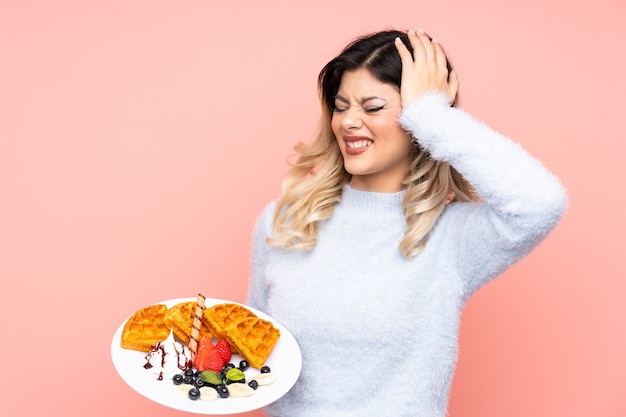 Teenager girl holding waffles