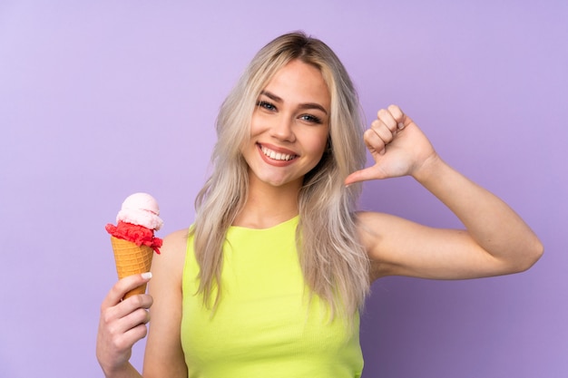 Teenager girl over isolated purple wall proud and self-satisfied