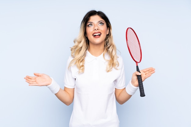 Teenager girl playing badminton