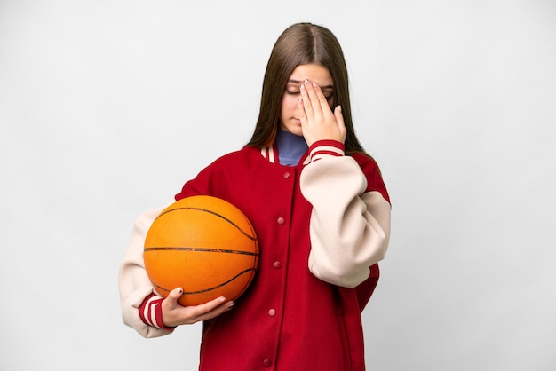 Teenager girl playing basketball over isolated white background with tired and sick expression