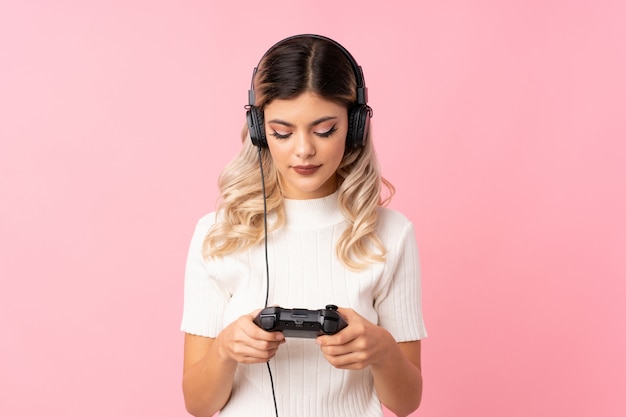 Teenager girl playing at videogames