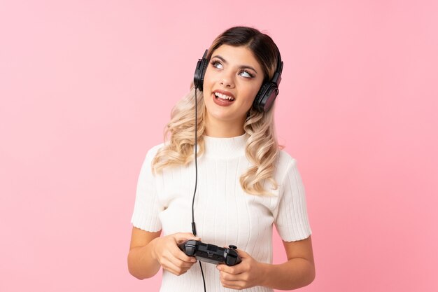 Teenager girl playing at videogames