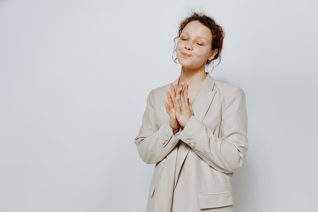 Teenager girl wearing coat against white background