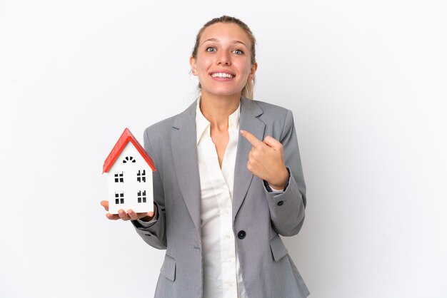 Teenager girl with braids holding a bag to recycle showing a sign of silence gesture putting finger in mouth