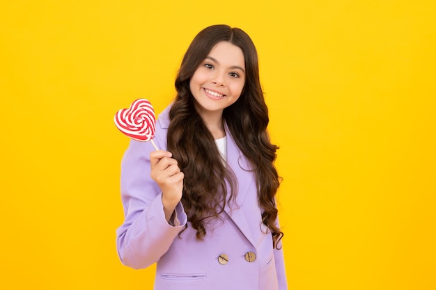 Teenager girl with caramel candies on sticks sweet sugar addiction Child with lollipops Happy teenager positive and smiling emotions of teen girl