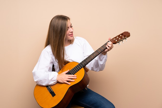 Teenager girl with guitar