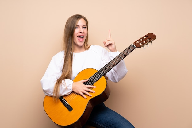 Teenager girl with guitar 