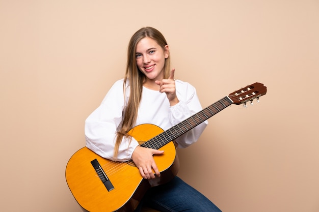 Teenager girl with guitar 