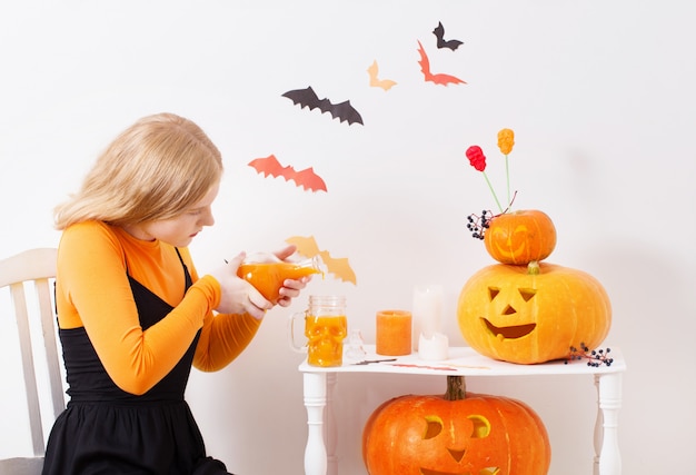 teenager girl with halloween decorations