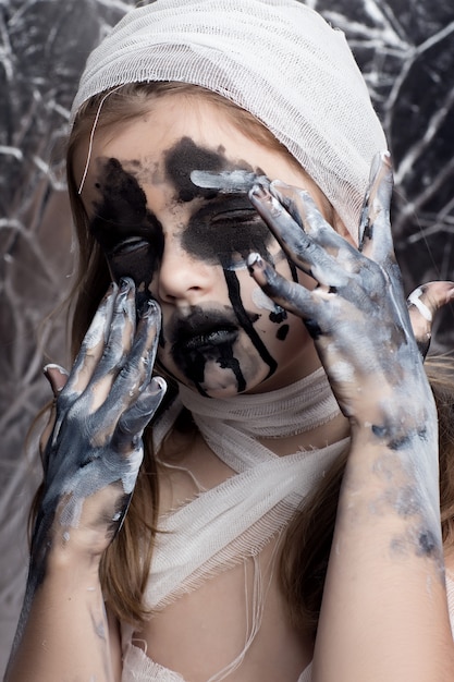 Teenager girl with Mummy bandages on Halloween