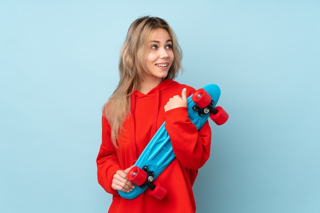 Teenager girl with a skateboard