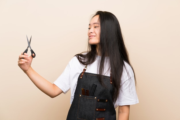 Teenager hairdresser girl with happy expression