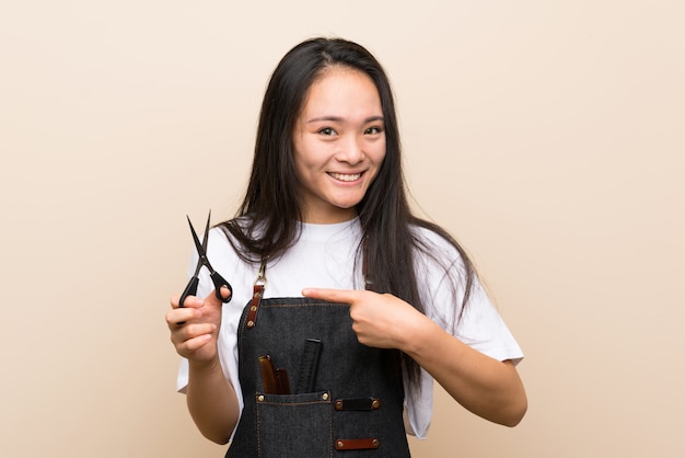 Teenager hairdresser girl with surprise facial expression