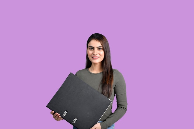 Teenager happy student girl holding file indian pakistani model