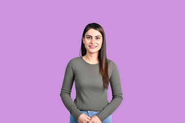 Teenager happy student girl isolated on purple background indian pakistani model