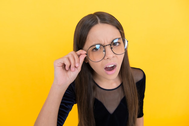 Teenager has poor eyesight. need to improve eyesight. childhood health. oh no. teen girl wear glasses. express human emotions. smart looking child. kid accessory fashion. oculist concept.