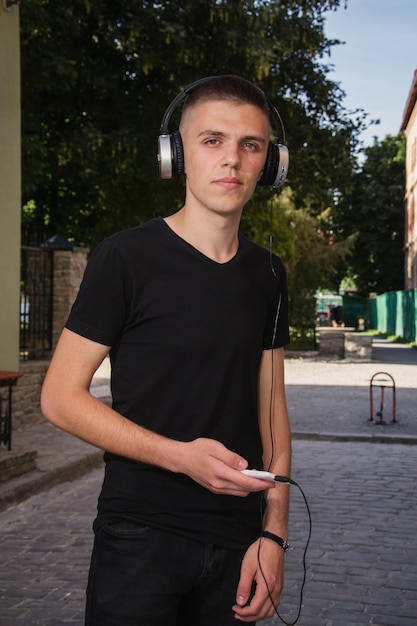 Teenager in headphones on the street