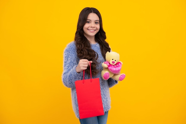 Teenager hold shopping bag enjoying sale child girl is ready to go shopping happy teenager positive and smiling emotions of teen girl