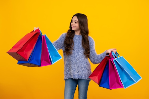 Teenager hold shopping bag enjoying sale child girl is ready to go shopping happy teenager positive and smiling emotions of teen girl