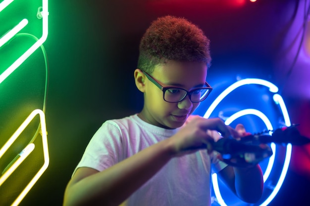 Teenager involved in a game with a toy helicopter