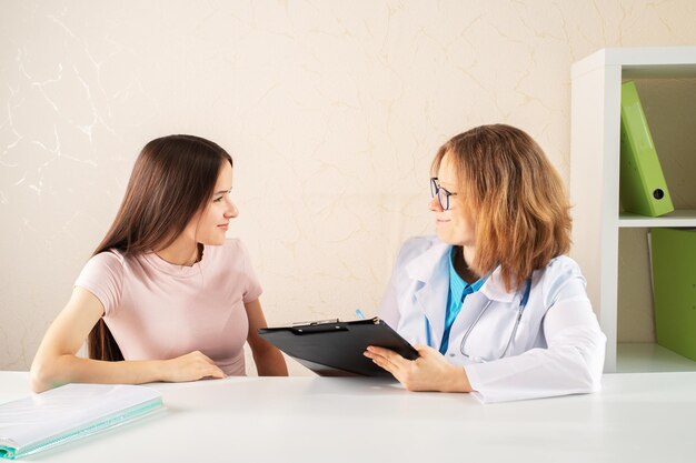 teenager is a patient at a medical examination in a medical clinic