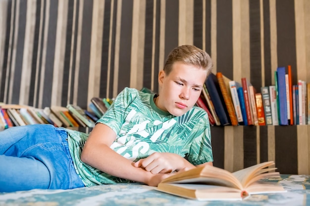 The teenager is reading a book selective focus