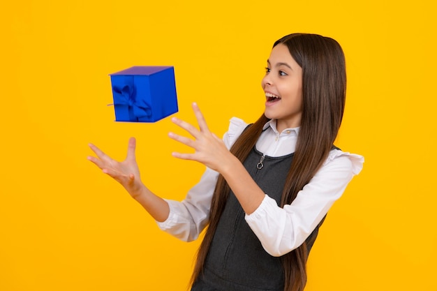 Teenager kid with present box teen child girl giving birthday\
gift present greeting and gifting concept