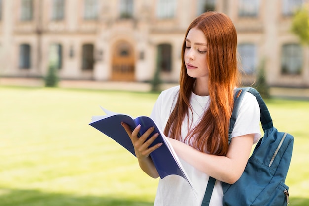 Teenager looking through project notes