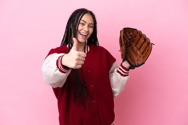 Teenager player with baseball glove isolated on pink background with thumbs up because something good has happened