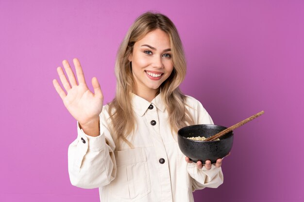 Teenager Russian girl isolated on purple