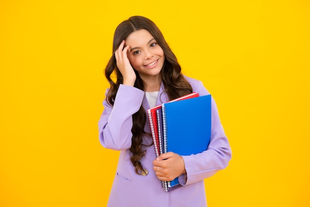 Teenager school girl with books isolated studio background