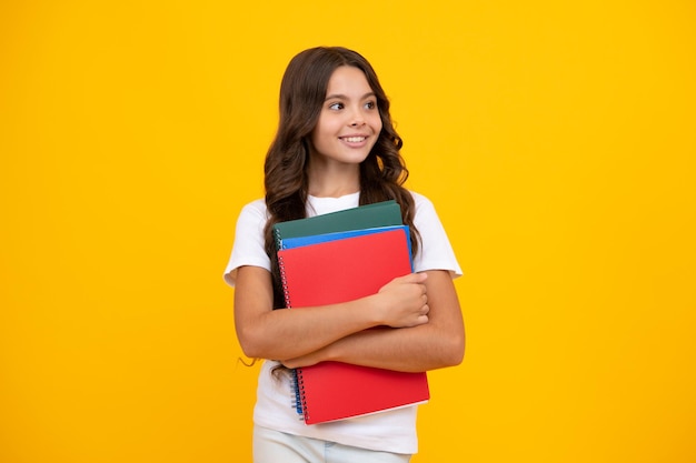 Teenager school girl with books isolated studio background