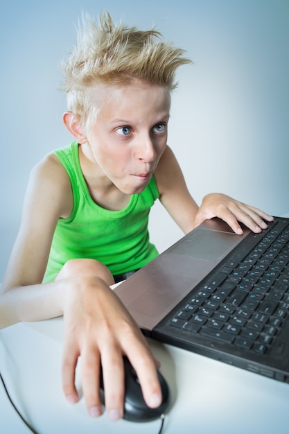 Teenager sitting behind a computer