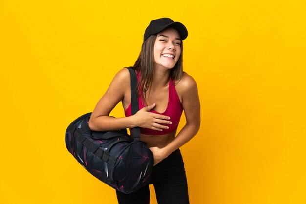 Teenager sport girl with sport bag smiling a lot