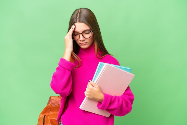 Teenager student caucasian girl over isolated background with headache