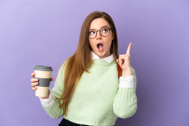 Teenager student girl over isolated purple background thinking an idea pointing the finger up