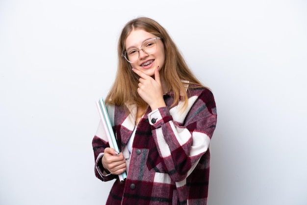 Teenager student Russian girl isolated on white background happy and smiling