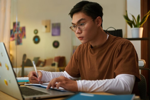 Teenager studying at home