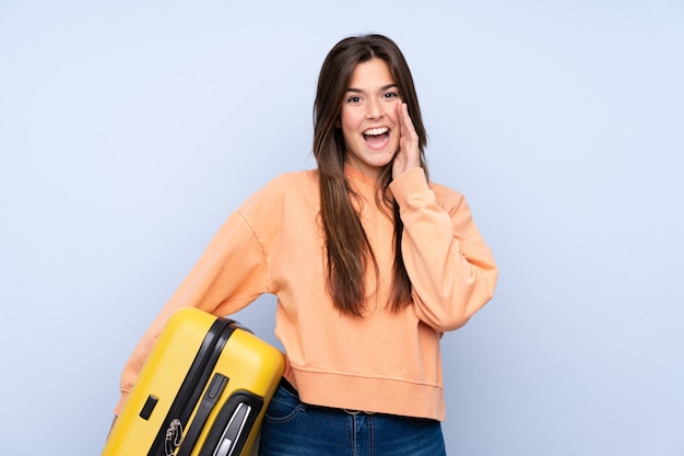 Teenager traveler woman with suitcase