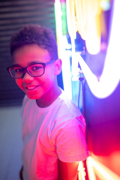 Teenager in trendy eyeglasses posing for the camera